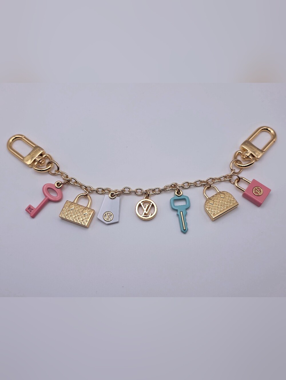 Upcycled Gold  Bag Charm/Extendar with White Enamel Tags and Blue Key